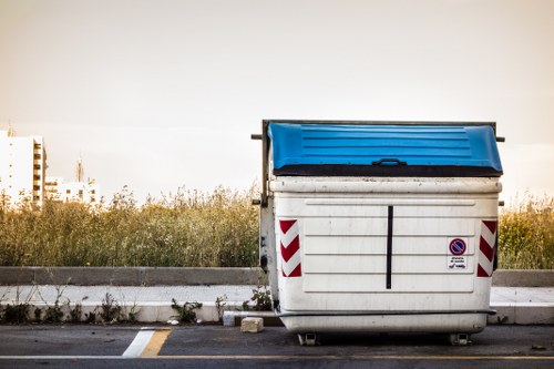 Skip hire truck outside a residential street in Belmont