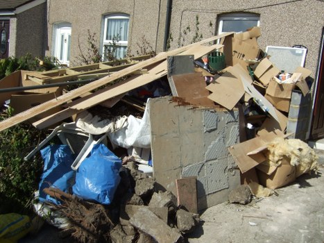 Local waste removal team working on a construction project